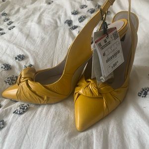 Zara yellow bow sling back pumps.